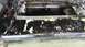 1996 Ford Bronco - The black tailgate shows significant peeling paint, revealing exposed metal underneath. This part is from a vehicle undergoing body work.