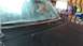 1996 Ford Bronco - Front view of a car's hood and windshield, showing an antenna and interior details.