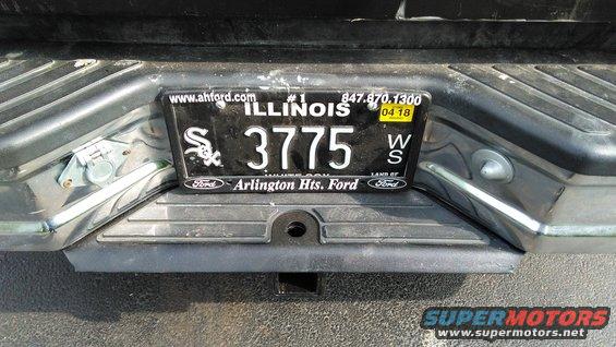 Rear bumper with Illinois license plate 3775 and a trailer hitch