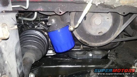 blue oil filter and black CV axle boot