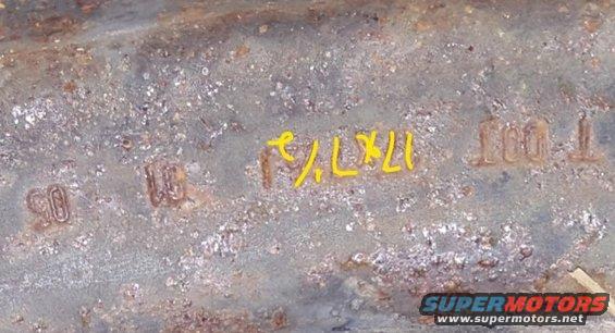 Rusted metal part with stamped markings '90', '10', '17x7J', and 'DOT T'