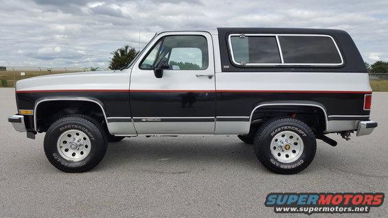 Two-tone silver and black Chevrolet K5 Blazer with red stripe