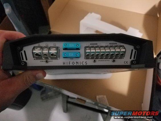 Hifonics car amplifier with power input and speaker output terminals, and two 60A fuses