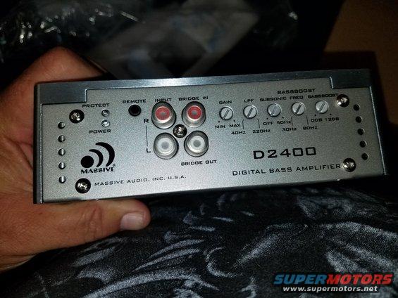 Massive Audio D2400 digital bass amplifier with various input/output jacks and control knobs