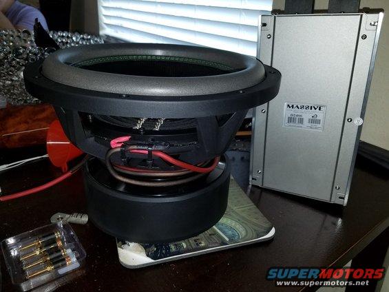 Subwoofer and Massive amplifier on a table