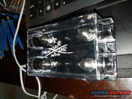 Clear power distribution block with 'HIGH SKY CAR AUDIO' logo and four large bolts