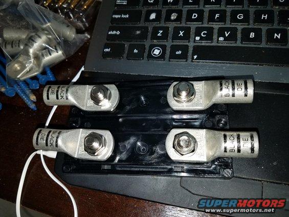 Car stereo terminals labeled 'BLACK DIE' on a black plastic mount