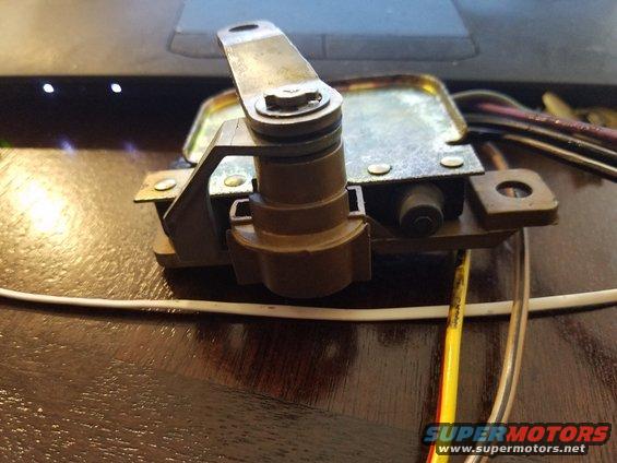 Close-up of a tailgate latch mechanism with wires attached