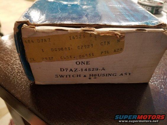 Cardboard box with yellow and white labels showing part number D7AZ-14529-A, SWITCH & HOUSING ASY