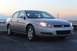 2007 Chevrolet Impala - Silver Chevrolet sedan parked on asphalt with a sunset sky in the background.