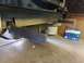 1988 Ford Bronco - Custom metal bars are welded to the rear bumper assembly of a vehicle.