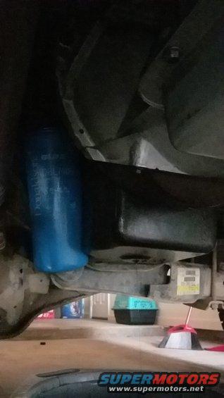 Tight fit but it clears just fine. Hangs below oil pan slightly but not enough to worry about. 