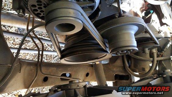 Engine belt pulleys and belts on a vehicle