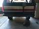 1988 Ford Bronco - The rear of a Ford Bronco shows a custom bumper and spare tire mount.
