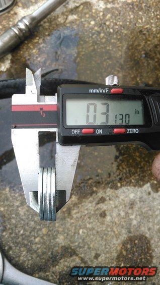 kimg0082.jpg this is how much of a shim i used betweent he axle mounting and the caliper bracket. i could probably of used less. i did need longer bolts to mount on the axle

the instructions said 1/8&quot; (0.125&quot;) but i did not see that was enough.