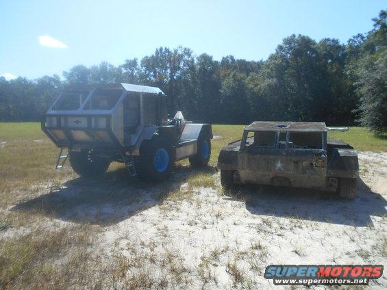 Two custom vehicles, one with a large cabin and blue wheels, the other a smaller, boxy, dark vehicle with a star emblem