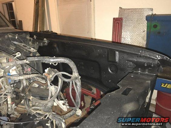 Engine bay with wiring harness and black fender liner