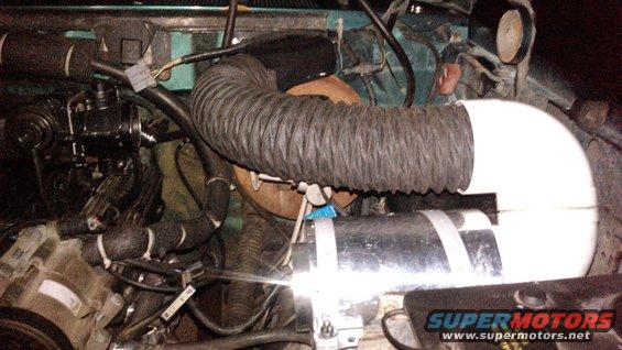 kimg0107.jpg i have the inlet of the filter complete.

i struggled finding a good way to do this. but this is the end result of the inlet side of the filter. 

i used some angle iron and plastic strapping to mount the filter housing steady and far enough away from the fender to fit. i also needed to make sure the hood hinge cleared the elbows.

i used 4inch sewer (3034, not sch40) 90* elbows. the flex hose from the cowl intake fits very nicely inside the hub of the elbow to where it will not come out of its own but its easy to insert. i used some machine screws to keep the elbow mounted to the housing