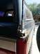1988 Ford Bronco - Close-up of the rear corner of a vehicle, focusing on the antenna mount and taillight assembly.