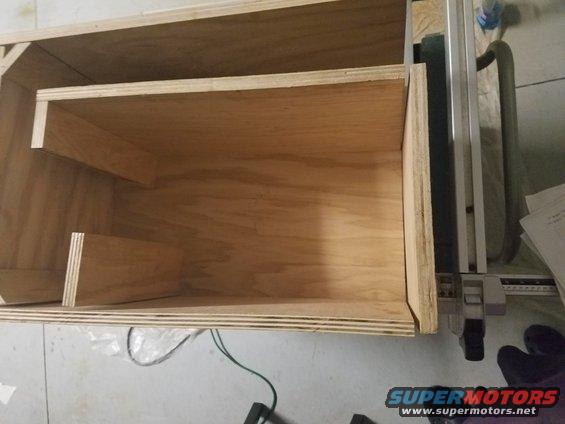 Custom wooden speaker box interior with shelves