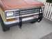 1987 Ford Bronco II - Front view of a 1987 Ford Bronco II, its grille and an aftermarket brush guard.