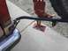 1987 Ford Bronco II - A hi-lift jack is mounted to the rear of a vehicle, ready for off-road use.