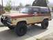 1987 Ford Bronco II - This lifted 1987 Ford Bronco II features a two-tone paint scheme and an aggressive aftermarket front bumper.