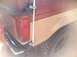 1987 Ford Bronco II - Close-up of the rear corner of a vintage pickup truck, highlighting the taillight and off-road tire.