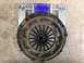 1987 Ford Bronco II - A clutch assembly is weighed on a digital scale, showing a part number for identification.