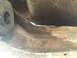 1984 Ford Bronco - Close-up view of a heavily rusted vehicle frame component, showing signs of wear and tear.