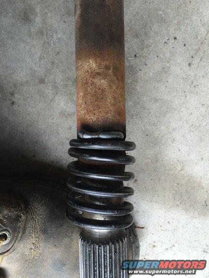 Driveshaft with spring and splines, showing weld
