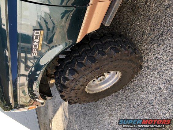 1994 Ford Bronco fender with 'BRONCO' badge and large off-road tire