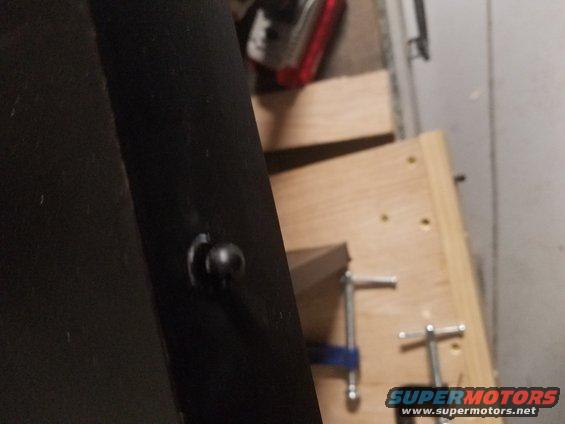 Black interior panel with a black knob