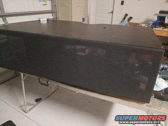 Black speaker box on a folding table
