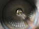 1987 Jaguar XJ6 - View from inside a vehicle's exhaust pipe, showing leaves and debris at the opening.