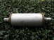 1987 Jaguar XJ6 - A Magnaflow exhaust muffler is shown against a backdrop of green leaves.