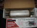 1987 Jaguar XJ6 - A Magnaflow exhaust muffler is shown inside its packaging, with product specifications printed on the box.