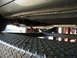 1987 Jaguar XJ6 - Underside view of a vehicle's exhaust system, showing pipes and muffler, elevated on a service lift.
