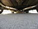1987 Jaguar XJ6 - Underside view of a vehicle's dual exhaust system, showing pipes and clamps.