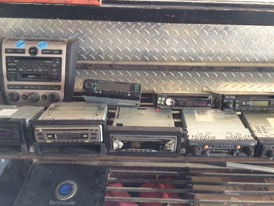 Assortment of car stereos on shelves