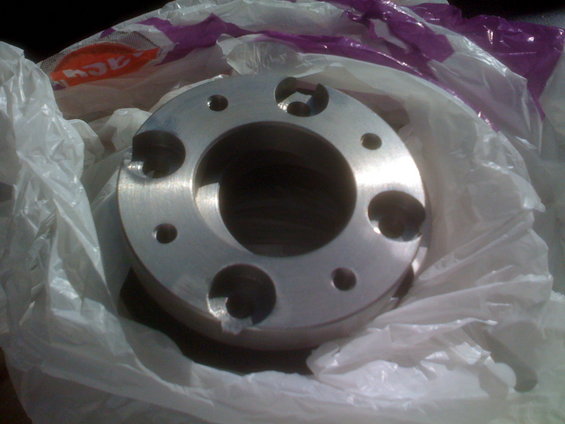 Aluminum wheel spacer with multiple bolt holes