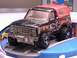 1979 Ford Bronco - This toy truck, likely a 1978 model, is black with an orange top and "Monster" graphics on its side.