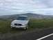 2003 Mercury Marauder - Silver 2003 Mercury Marauder sits on a grassy overlook with a village below.