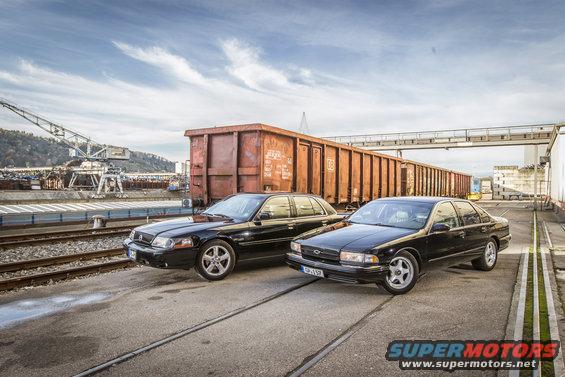 Black 2003 Mercury Marauder and a Chevrolet Impala parked side-by-side