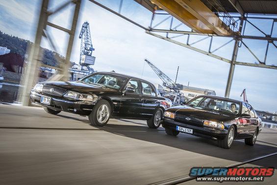 2003 Mercury Marauder and a Chevrolet Impala driving side-by-side