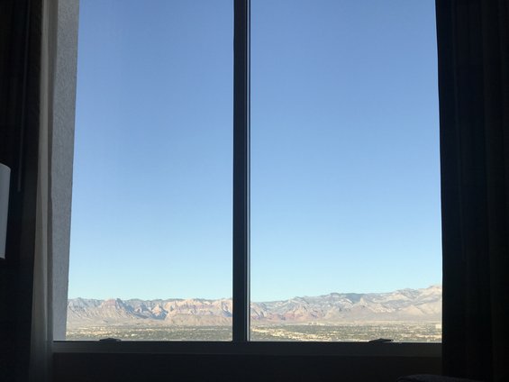 View of mountains and city through a window