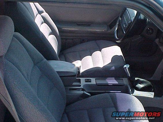 1992 Ford Mustang interior with gray cloth seats, center console, and steering wheel visible