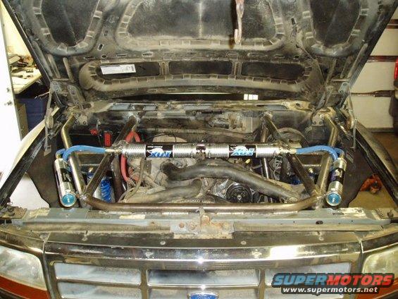 Engine bay with Fox shocks and custom roll cage