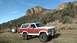 1981 Ford Bronco - This Ford Bronco is parked outdoors with a rocky mountain landscape behind it.