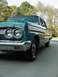 1964 Mercury Comet - Front 3/4 view of a teal 1964 Mercury Comet sedan, showing the distinctive grille and dual headlights.